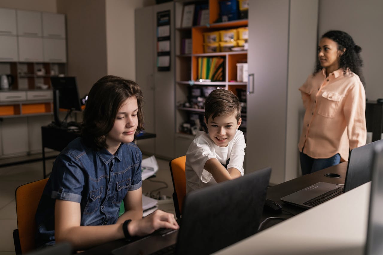 Students using laptops in a modern classroom